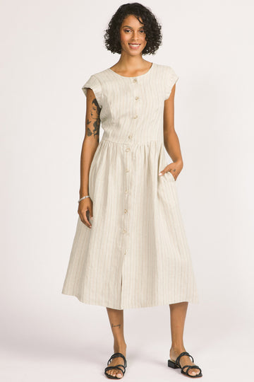 Woman wearing ivory stripe button up linen midi Blythe dress by Allison Wonderland. 