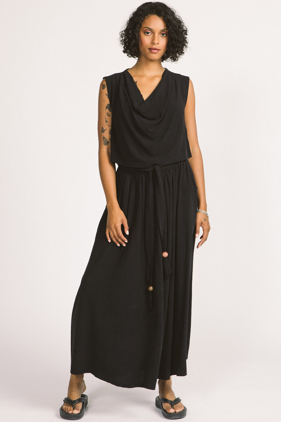 Woman wearing black Oriana maxi skirt by Allison Wonderland. 