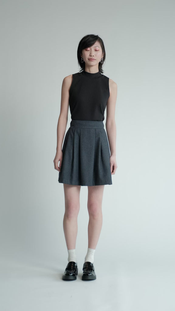 Video of model in studio wearing denim pinstripe Allison Wonderland Trouble Skirt.