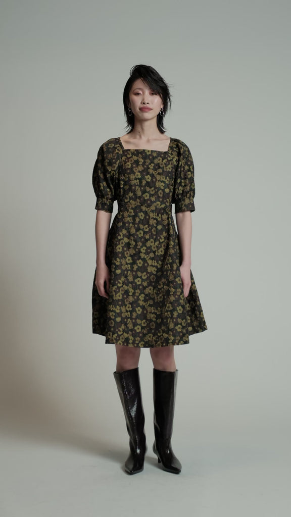 Video of a model in a studio wearing a Priority Dress.