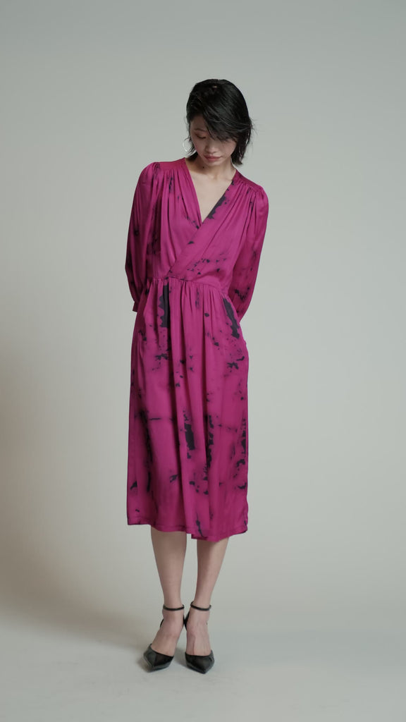 Video of a model in a studio wearing a pink Therapy dress.